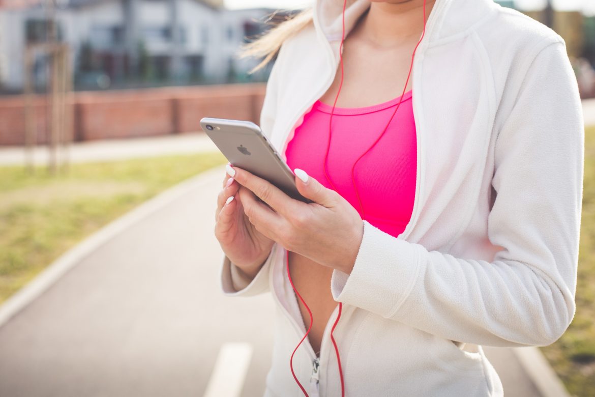 woman exercising with phone